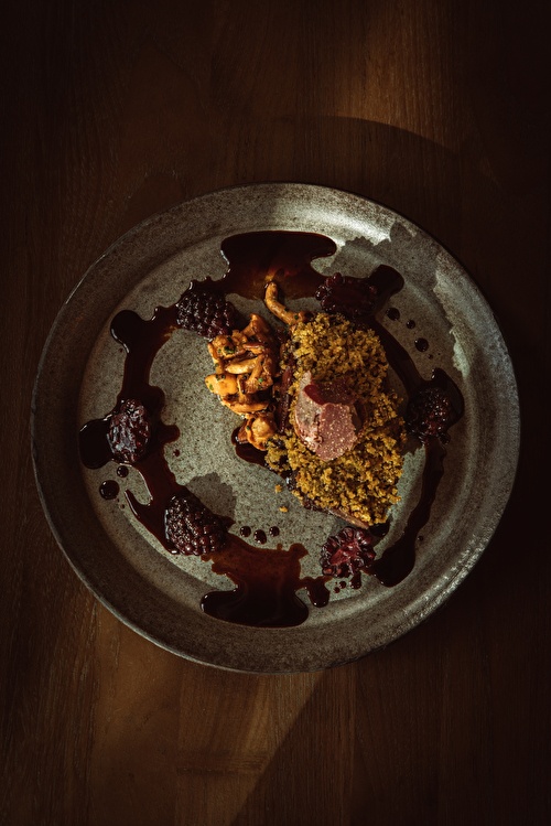 Picture from the exterior, viewing into the warmth inside of De Mark