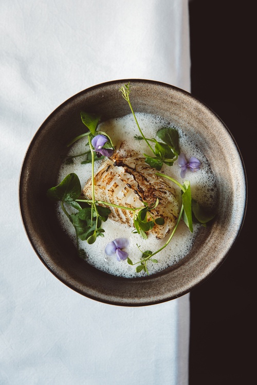 Picture from the exterior, viewing into the warmth inside of De Mark